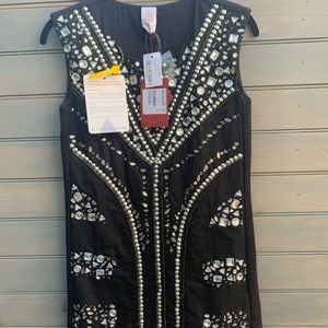 Dress with ringstones